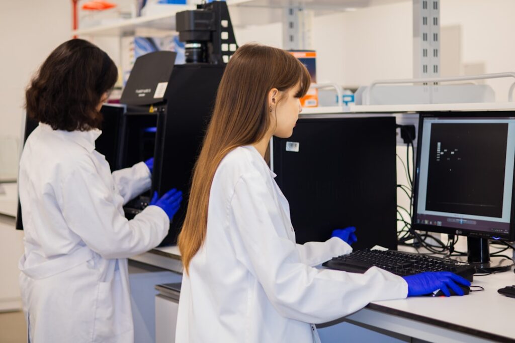 A variety of lab coats hanging on a rack, showcasing different styles and colors, emphasizing comfort and professionalism.