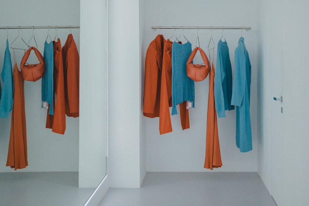 A collection of colorful scrubs neatly arranged on hangers, showcasing various styles and fabrics suitable for healthcare professionals.