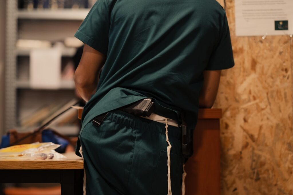 A diverse group of healthcare professionals wearing well-fitted scrubs, showcasing different body types and styles in a clinical setting.